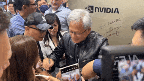 Nvidia CEO Jensen Huang signs woman’s chest at tech expo in Taiwan